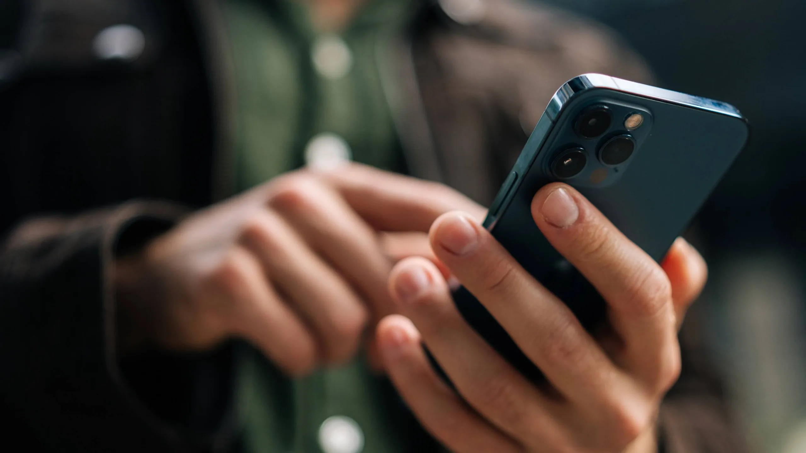 Close-up of a person using a smartphone.